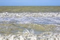 The rough sea - Storm surge with waves, foam and muddy water