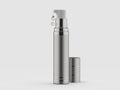 Rough silver color cosmetic and skin care airless dispenser with a drops of clear serum