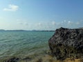 Rough-skinned rocks by the blue sea,