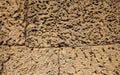 Rough stone ancient wall closeup photo. Stone wall texture. Rustic stone wall of ancient building. Royalty Free Stock Photo