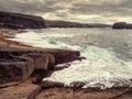 Rough stone coast with cliffs and ocean scene. Ireland, Kilkee area. Travel, tourism and sightseeing concept. Irish landscape and