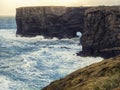 Rough stone coastline, Cliffs of Kilkee county Clare, Ireland. Wild Irish nature landscape. Popular travel area with stunning