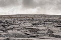 Rough stone terrain in Burren National park, county Clare, Ireland. Cloudy sky Royalty Free Stock Photo