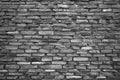 Rough stone wall made of ceramic tiles of different sizes. Royalty Free Stock Photo
