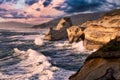 Rough stormy seas on the rocky shore with big scary waves.