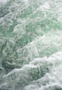 Rough stormy water in the river as a backdrop Wave or rapid current vertical background