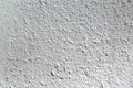The rough surface of the concrete wall. Plaster is painted with gray paint. Royalty Free Stock Photo