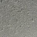 Asphalt exhibits natural wear, highlighting the irregular distributi Royalty Free Stock Photo