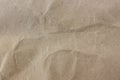 rough texture of crumpled beige packaging craft paper