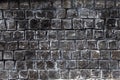 Rough texture of gray granite bricks wall Royalty Free Stock Photo