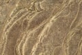 Rough texture of layered stone photo. Yellow ancient stone floor background. Weathered rock relief surface closeup. Royalty Free Stock Photo