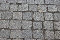 Rough texture of wet block pavement, Saint Malo old side-street. granite Royalty Free Stock Photo