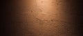 The rough-textured concrete patterned background on maroon wall provide a backdrop of bright light and shadow dark Royalty Free Stock Photo