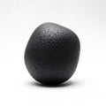 A rough textured dark gray spherical object isolated on a clean white background isolated on white background Royalty Free Stock Photo
