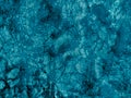 Rough textured light turquoise cosmic blue matte abstract stone with cracks and relief background. Wall. Ice Royalty Free Stock Photo