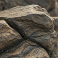 Rough-textured rock formation with visible stratification, displaying layers and Royalty Free Stock Photo