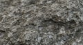 Rough-textured rock surface featuring a composite of various minerals. Royalty Free Stock Photo