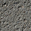 Rough textured surface with a mix of gray cement and various small pebbles Royalty Free Stock Photo