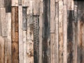 Rough textured timber wall made of stained mismatched recycled old planks