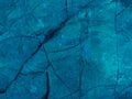 Rough textured turquoise cosmic blue matte abstract stone with cracks background Royalty Free Stock Photo