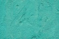 Rough Turquoise plaster wall texture with rough painted surface, brush strokes, subtle irregular details. Concept of texture Royalty Free Stock Photo
