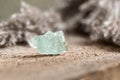 Rough Uncut Pale Blue Aquamarine Gemstone on Wood