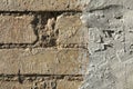 Rough, uneven surface. Cement plaster on a brick wall, texture, background. Old, sloppy, careless brickwork Royalty Free Stock Photo