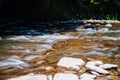 Rough water in the mountains, water flows over the rocks, forest, nature, mountains, waterfall, background Royalty Free Stock Photo