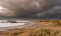 Looking back at Rhosneigr with rough seas Royalty Free Stock Photo