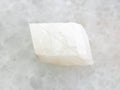 rough white calcite stone on white marble