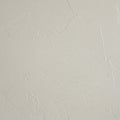 Rough white plaster wall surface with visible texture and irregular patterns. The surfa Royalty Free Stock Photo