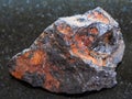 rough Wolframite stone (tungsten ore) on dark