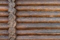 Rough wooden beams background, brown log wall texture close-up