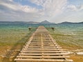 Rough wooden pier, over sea water, Gialova lagoon, Peloponnese, Greece Royalty Free Stock Photo