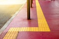 Yellow dot tactile paving for blind handicap on tiles pathway in japan, walkway for blindness people Royalty Free Stock Photo