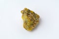 Rough yelow opal crystal, unpolished mineral. Close-up, white background