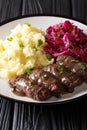 Rouladen or Rinderrouladen is a German beef, with bacon, onions, mustard and pickles served with mashed potatoes and red cabbage Royalty Free Stock Photo