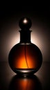 Elegant Amber Perfume Bottle with Dramatic Lighting Royalty Free Stock Photo