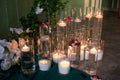 Round arch for the ceremony with candles the floor