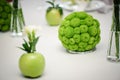 Round arrangement on the Bridal table in green color and apple. Wedding floristry Royalty Free Stock Photo