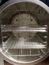 Round autoclave chamber with rack and shelves Royalty Free Stock Photo