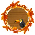 Round autumn leaves banner template with a toucan cartoon character
