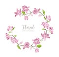 Round background, border or frame made of branches with tender pink blooming magnolia flowers and green leaves Royalty Free Stock Photo