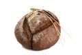 Round baked bread with three spikelets on a white background