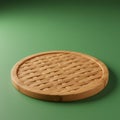 Round bamboo trivet on a green surface. It features a woven pattern within a solid rim, Royalty Free Stock Photo