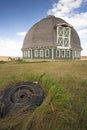 Round barn and tire in foreground. Royalty Free Stock Photo