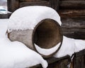 round barrel lies in the snow in winter