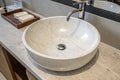 Round bathroom sink on marble stone surface Royalty Free Stock Photo