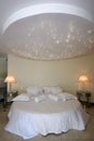 Round bed with stars lamp on the ceiling