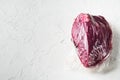 Round beef meat in vacuum, on white background,  with copy space for text Royalty Free Stock Photo